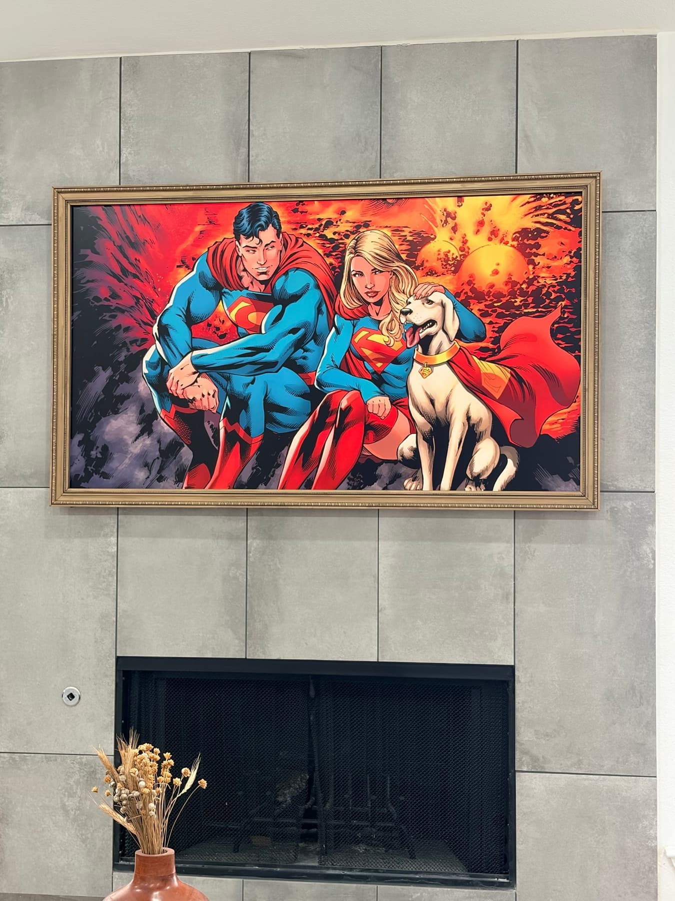 Samsung Frame TV displaying Superman artwork, mounted flush on a gray tile fireplace in a Dallas living room, no visible wires, Cognito Media Services install