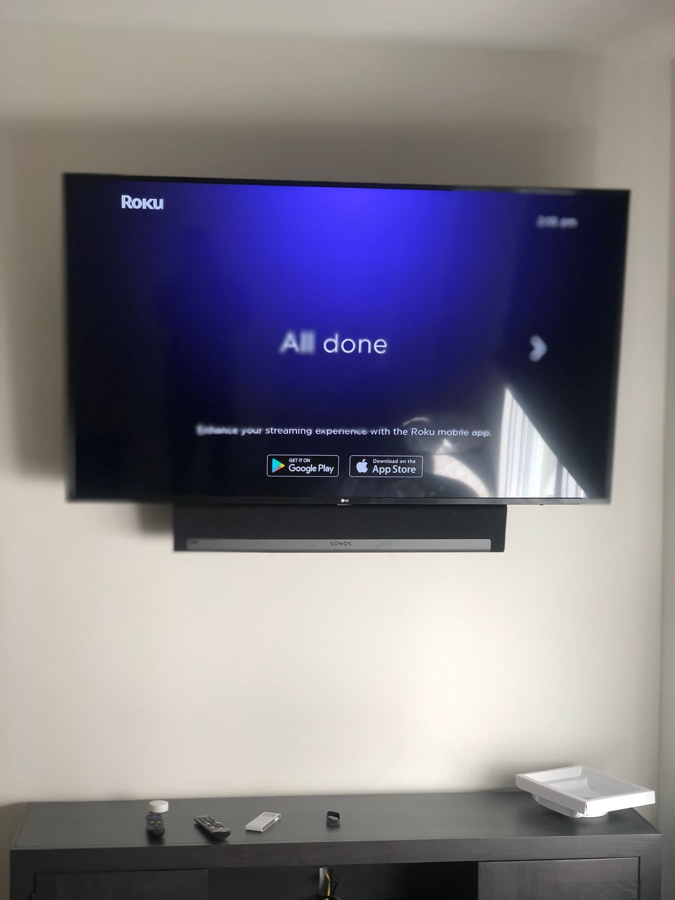 Wall-mounted LG TV with a Sonos Playbar soundbar installed beneath it in a Dallas home, Cognito Media Services install