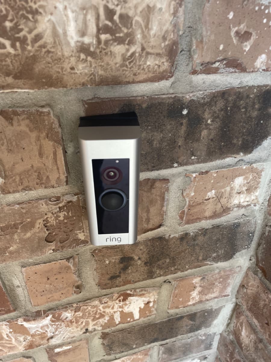 Ring doorbell professionally installed on brick wall in Plano TX by Cognito Media Services