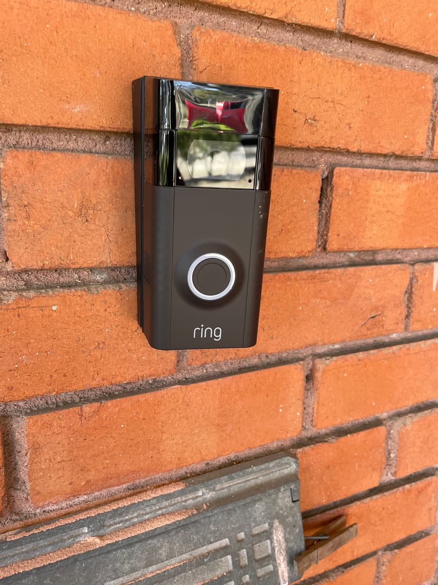 Ring doorbell professionally installed on red brick wall Allen TX by Cognito Media Services