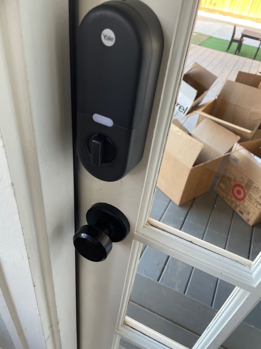 Yale smart lock installation on residential door in Richardson TX by Cognito Media Services