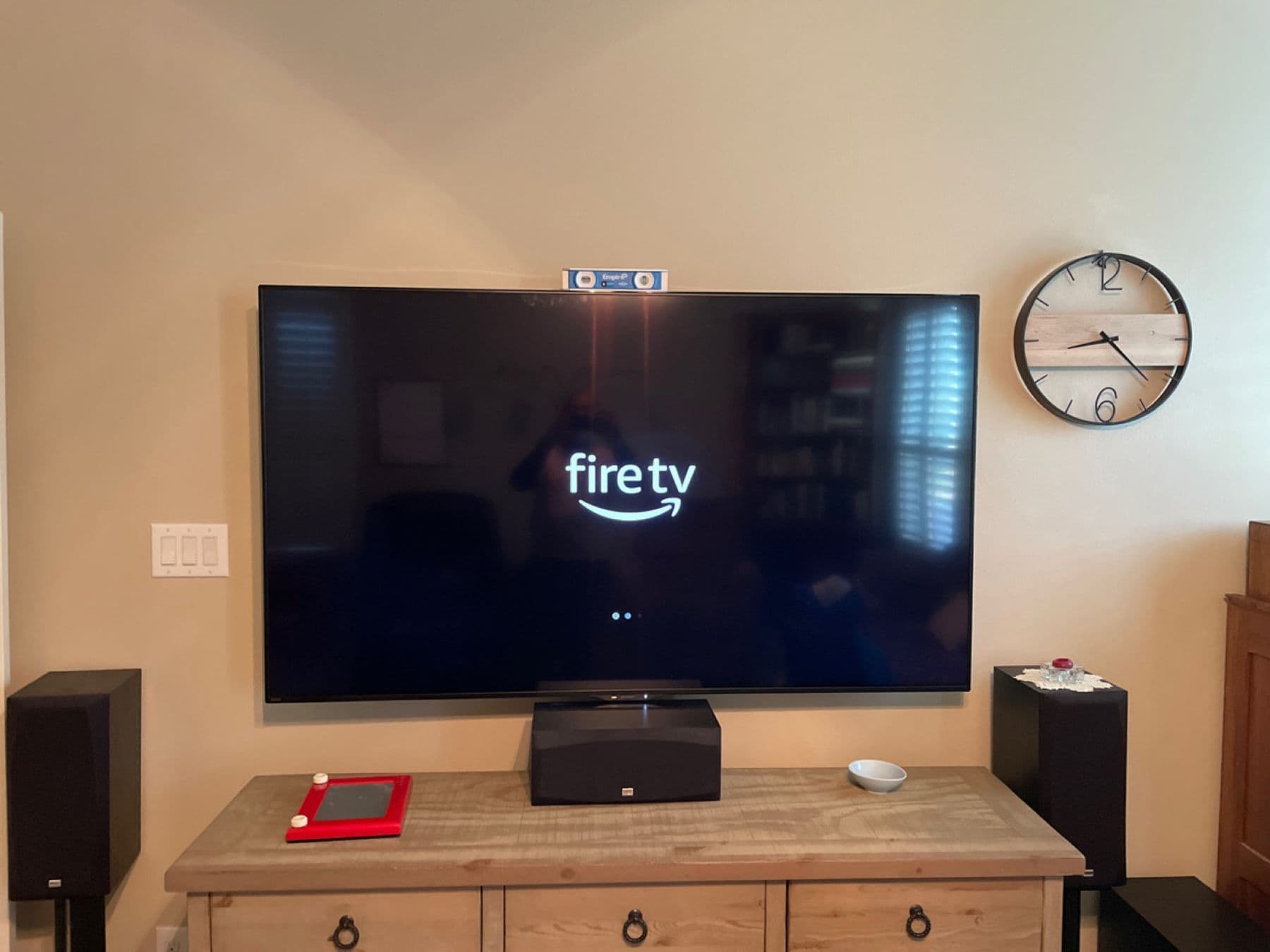 Large TV and speakers installed on a media console with Fire TV — Cognito TV installation, Dallas TX
