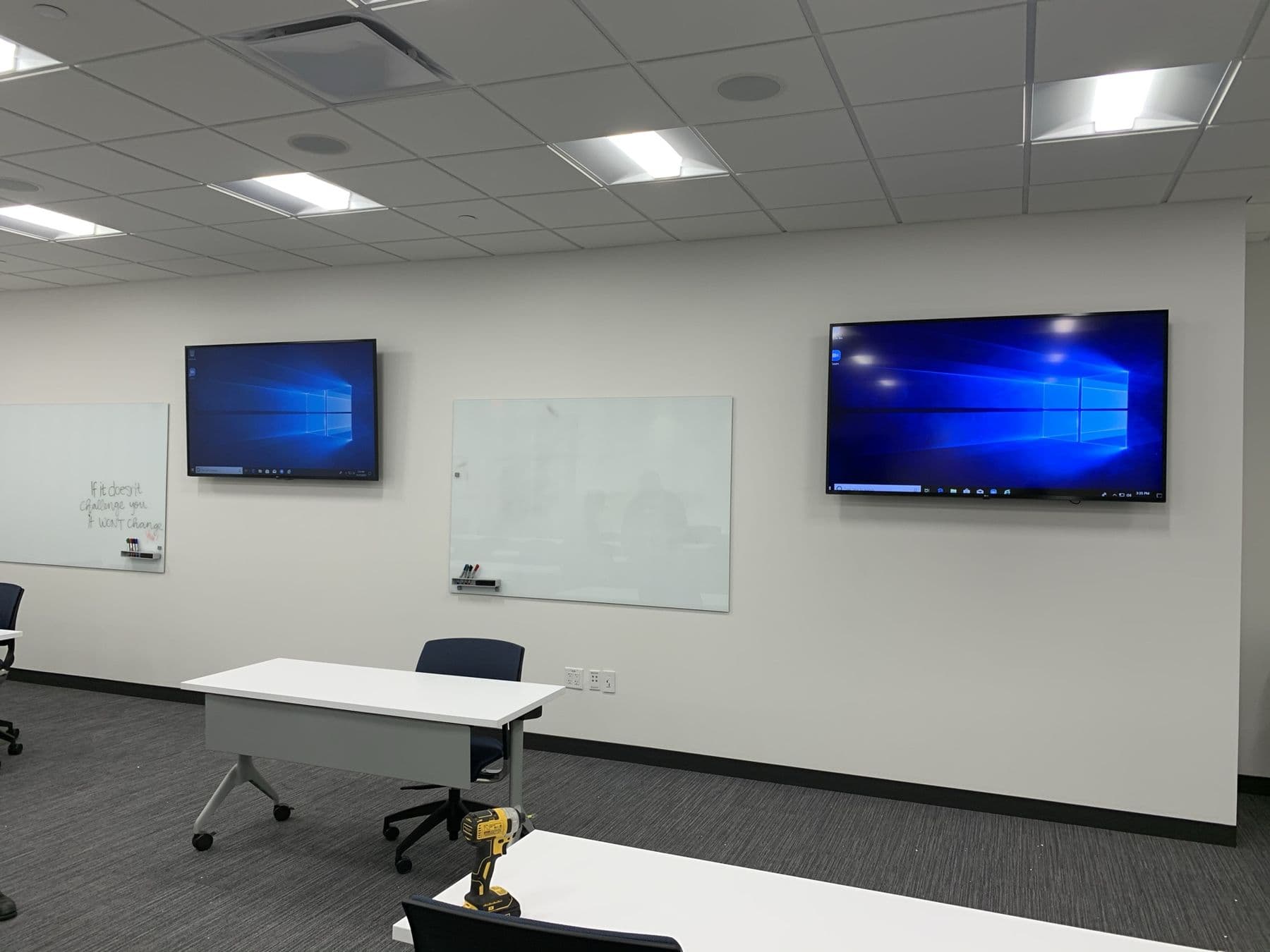Office with two wall-mounted displays and whiteboard — Cognito commercial AV install, Dallas TX