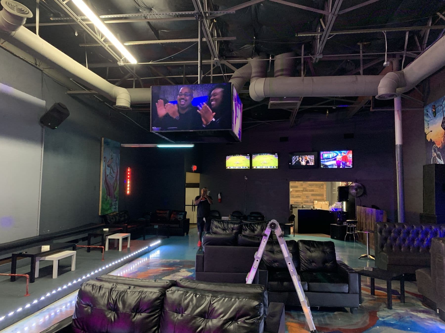 Commercial sports bar lounge with multi-screen video wall and distributed audio — Cognito commercial AV install, Dallas TX